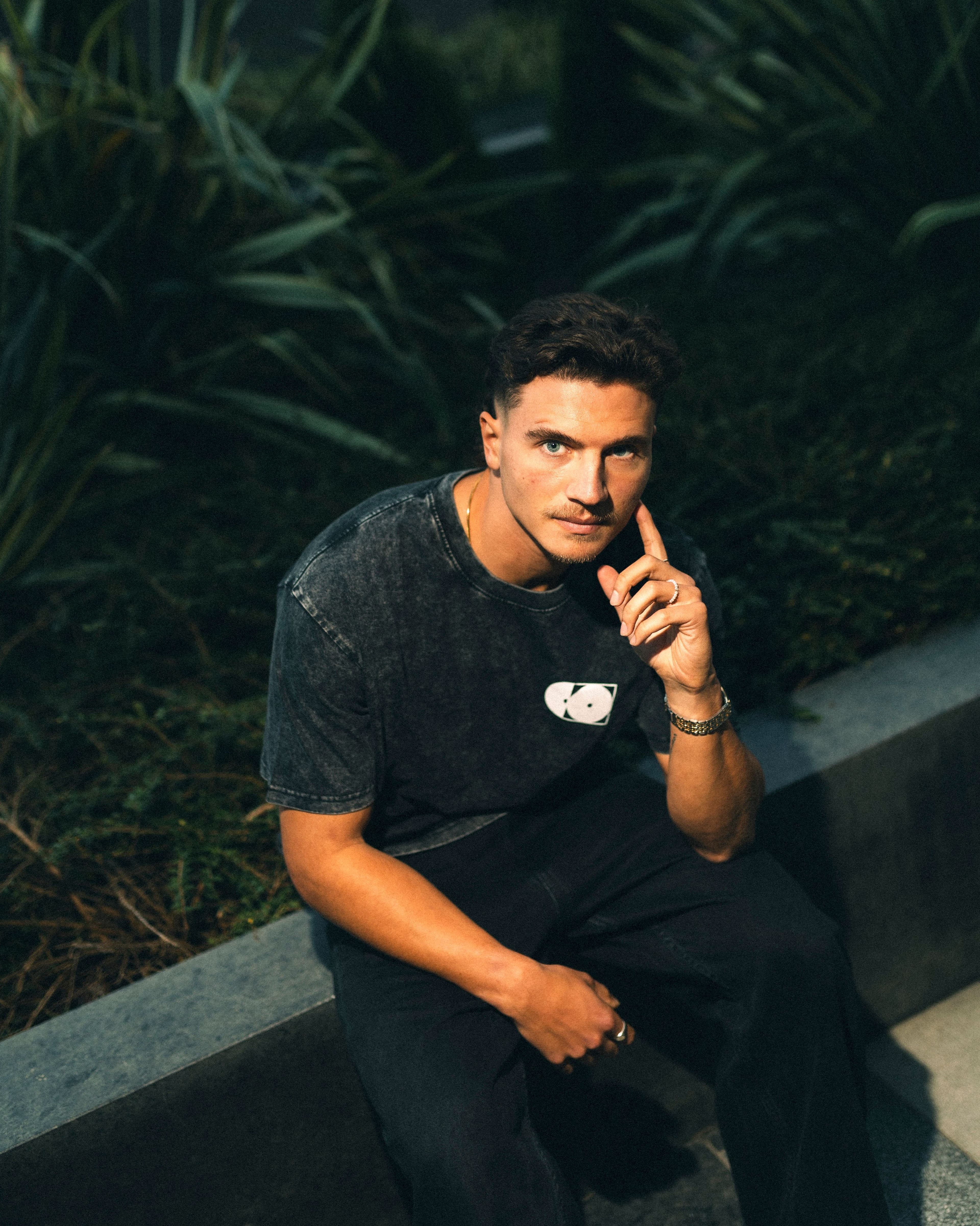 Black Merch Model Sitting